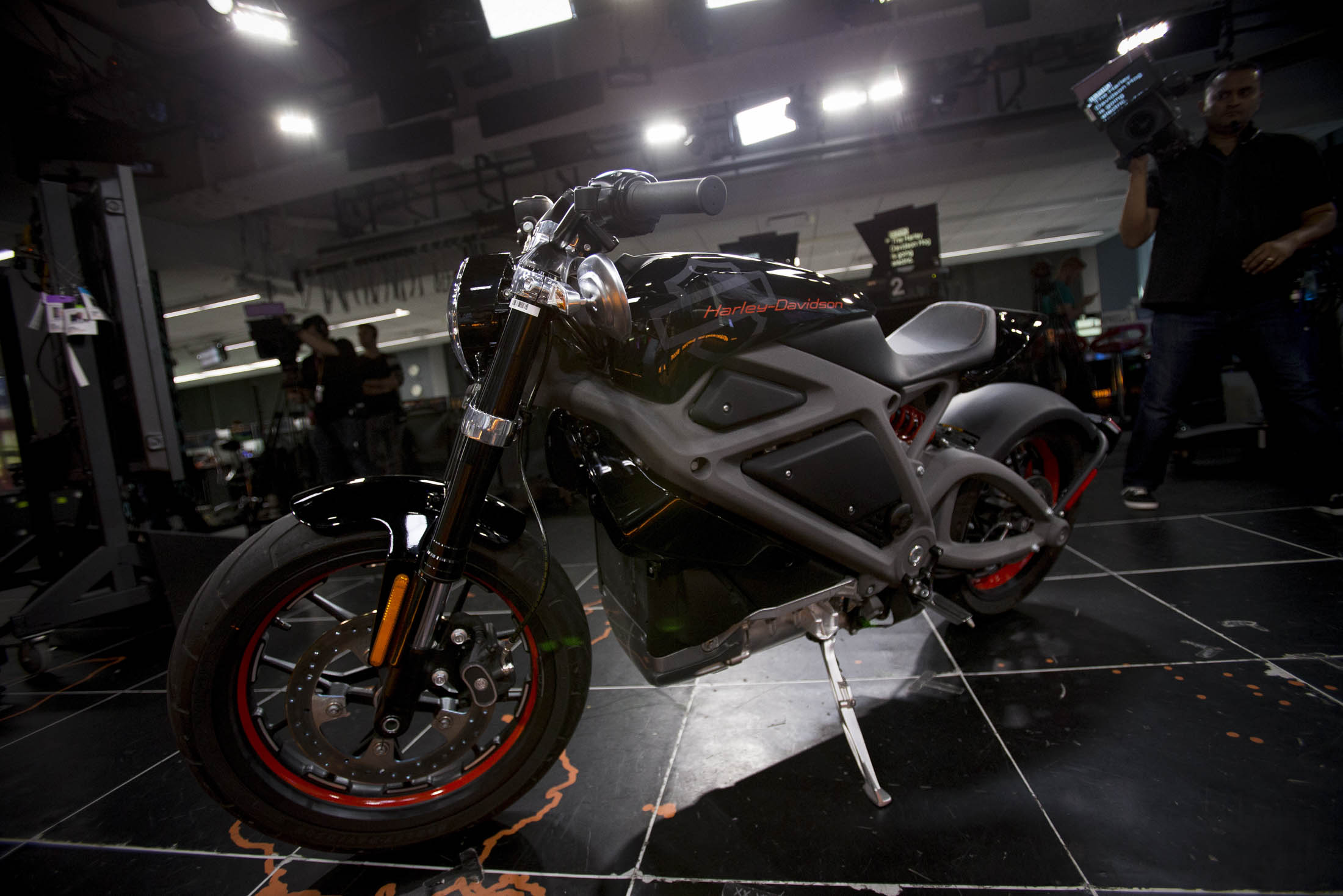 A Harley-Davidson Inc. LiveWire electric motorcycle sits parked in the Bloomberg Television studios in New York, U.S., on Monday, June 23, 2014. Harley-Davidson Inc., whose storied highway cruisers are as loud as they are large, will take 22 electric bikes on a U.S. tour to solicit reactions that will help shape the environmentally aware vehicle's development. Depending on the feedback, the no-exhaust Harley may never make it out of R&D. Photographer: Scott Eells/Bloomberg