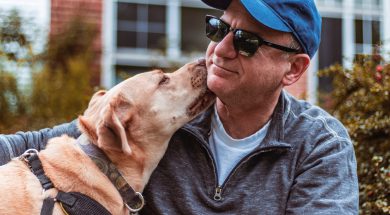 pet-dog-licking-face-of-man-2958113