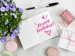 happy-birthday-card-beside-flower-thread-box-and-macaroons-2072181