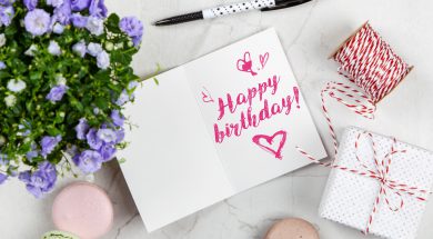 happy-birthday-card-beside-flower-thread-box-and-macaroons-2072181