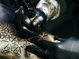 selective-focus-photography-of-tattoo-artist-drawing-a-tatoo-1304469