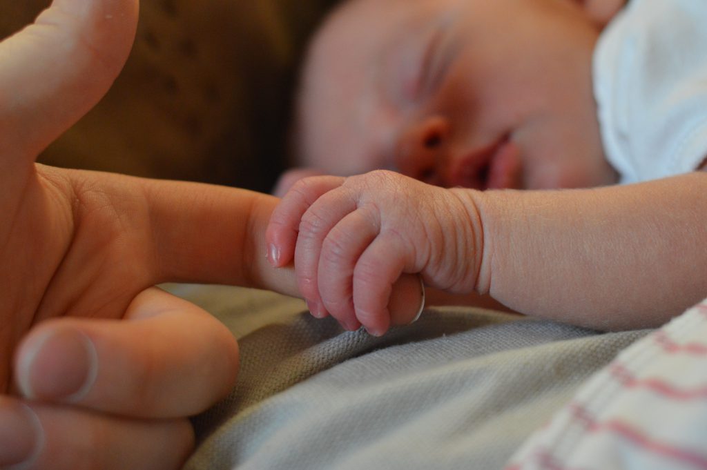 baby-holding-human-finger-225744 (1)