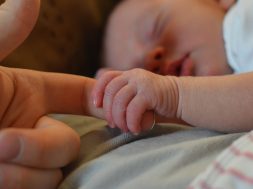 baby-holding-human-finger-225744