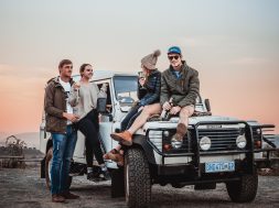 photo-of-people-on-a-white-suv-2590596
