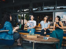 four-women-chatting-while-sitting-on-bench-1267697 (1)