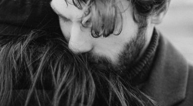 grayscale-photo-of-man-hugging-person-3692739