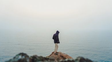 man-standing-on-sea-cliff-3464179