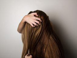 photo-of-woman-covering-face-with-her-hair-1159334
