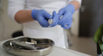 person-wearing-blue-gloves-3952378