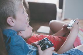 two-boy-and-girl-holding-game-controllers-1103563