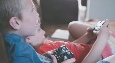 two-boy-and-girl-holding-game-controllers-1103563