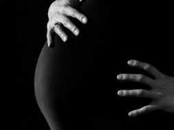 gray-scale-photo-of-a-pregnant-woman-46207