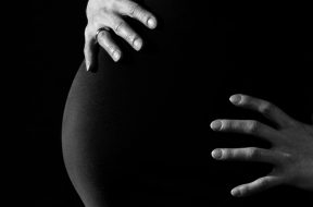 gray-scale-photo-of-a-pregnant-woman-46207