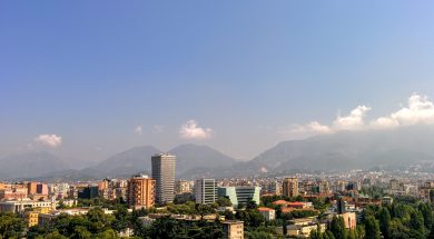 grey-concrete-building-in-the-middle-of-the-city-under-blue-131920
