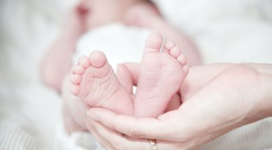 close-up-of-hands-holding-baby-feet-325690