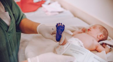 baby-with-ink-on-foot-4005611