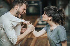 Furious couple fighting while having problems in their relationship.