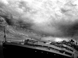 Heavy image with a large cruse ship seems to be sinking. Strong moody sky with a bit of grain making this image that much stronger.