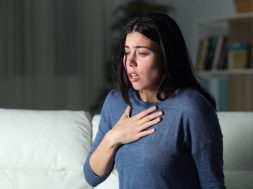 Woman suffering an anxiety attack alone in the night