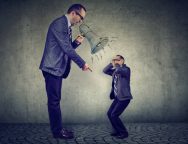 Angry business man boss screaming at himself small in megaphone
